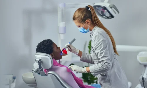 dentist-with-face-mask-checking-patient-s-teeth-2024-10-18-03-54-13-utc