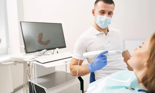 male-dentist-examining-woman-teeth-with-3d-dental-2023-11-27-05-19-21-utc